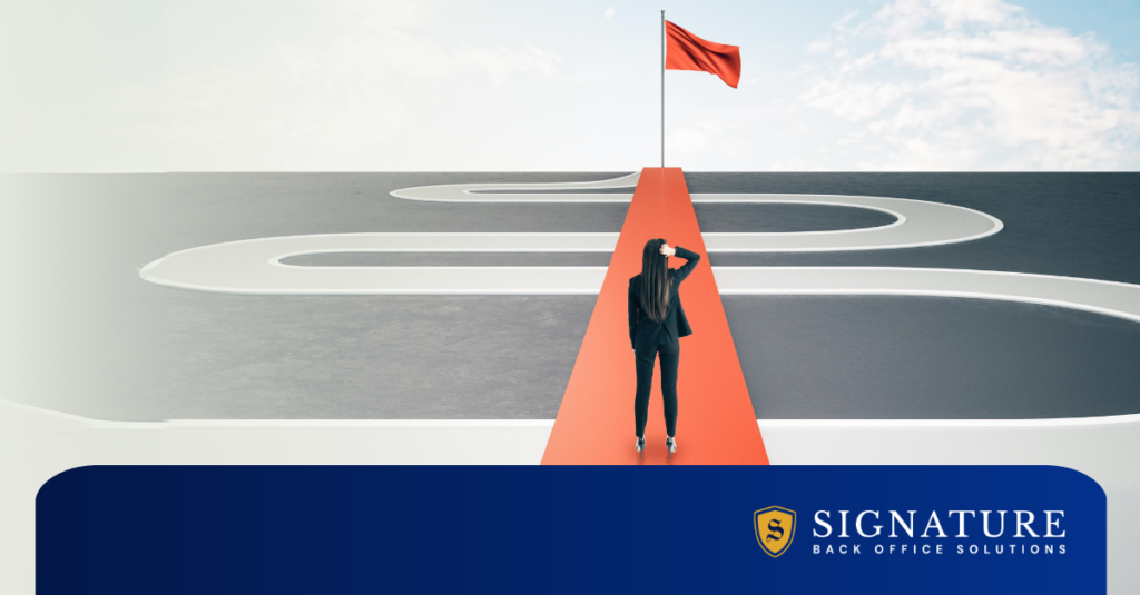 Woman in business attire standing at one end of a red bridge leading to a red flag, overlaying a winding monochromatic road